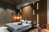 In Parents Bedroom ceiling is made up in Exposed RCC combining up with cylinder lights. Veneer along with lights is made in Bed Back. Wardrobe is in PU finish. The Exotic look in this bedroom provides unflustered weight to this space.