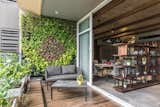 Cosy veranda and deck serves Wooden Tile in flooring and natural green walls uplifts the ambience of the deck with the wonderful view of the city. 

