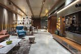 2400 X 1200 Matt tiles are used in flooring along with the wooden Patti and veneer finish on it at ceiling. Exposed RCC slab with wooden rafter is going to be used for decor and partition purpose. The common basin is made in corner with the Matt white satvario tiles.