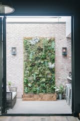 The main feature of the second floor outdoor space is a striking succulent installation sprawling nearly 12 feet tall on the outside patio, seen from almost any vantage point on the second level.