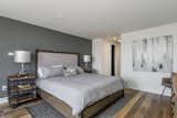 The master bedroom offers an industrial modern feel with neutral tones. 