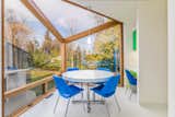 The breakfast nook  features triangular floor-to-ceiling windows with a skylight.