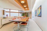 The formal dining room features Marcel Breuer chairs and long rectangular table.