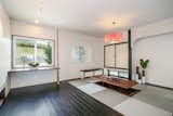 Living Room, Dark Hardwood Floor, and Pendant Lighting  Photo 11 of 15 in Japanese Builder Ichijo Creates Net-Zero Energy Home by PlanOmatic