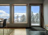 Living Room, Sofa, Ceiling Lighting, Medium Hardwood Floor, Table Lighting, Bench, End Tables, Bookcase, and Chair Andrew Michler  Photo 5 of 12 in Colorado Hideaway by OFF GRID HIDEAWAYS