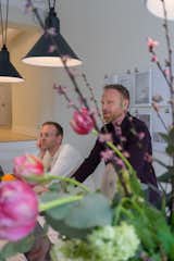 Partner Ola Kjellander (right) discusses plans to transform Malmö's Sege Park into a new sustainable district with centralized hubs that share tools and resources for the entire community.