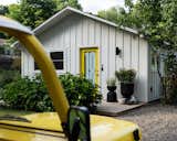 With a brand-new plan, vibrant decor, and a bright-yellow door, Ghislaine Viñas reinvigorated a 600-square-foot kit house for her family.