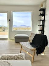 Living Room, Sofa, Floor Lighting, Recessed Lighting, Light Hardwood Floor, Bookcase, and Chair The outside becomes a key part of the house and allows the tiny house to feel expansive.  Photo 4 of 6 in The Bell Cabin by Ida Alwin