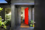 Entering the compound at the fluorescent coral front door