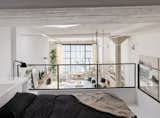 The mezzanine was extended to its maximum potential, creating space for an additional bathroom upstairs in the primary lofted bedroom area.