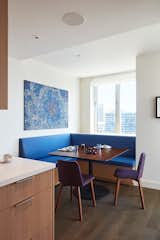 Overlooking the San Francisco Museum of Modern Art, this condo is infused with Bjørn Design’s soothing palette of blonde and dark-grey oaks, peppered with hints of blue and purple. In the kitchen corner, a custom banquette with built-in storage offers a bold, yet entirely practical dining nook.&nbsp;