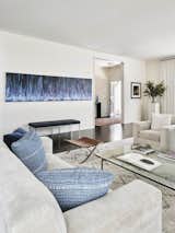 The living room.
A streaked abstract painting mirrors the pillowed blue textiles, below sits a Knoll bench.
The Fortuny fabric and Moroccan rug pull the space together.