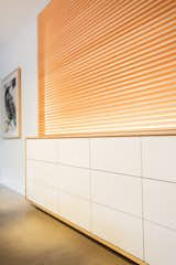 Dining Room, Pendant Lighting, Chair, Storage, Concrete Floor, and Table In the dining room, the sleek custom sideboard is cleverly inset into the wall to allow ample storage.  Photo 5 of 11 in Cooper Street Residence by Sarah Brown