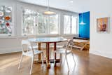 Dining Room, Table, Bench, Pendant Lighting, Recessed Lighting, Chair, and Cork Floor The cork floor, continued through the kitchen and eating areas, references a material that was just coming to the forefront as flooring during that time.  Photo 10 of 11 in 1980s Makeover by Sarah Brown