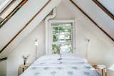 Powder room and sleeping loft, featuring the Hector Dome Wall Light from Original BTC
