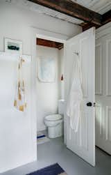 Powder room and sleeping loft, featuring the Hector Dome Wall Light from Original BTC
