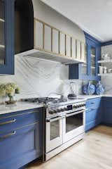 Kitchen, Range Hood, Colorful Cabinet, Range, and Light Hardwood Floor  Photo 2 of 4 in Bakes & Kropp | Galerie House of Art and Design 2021 by UpSpring PR