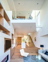 Similar in design language, the smaller of the two homes was built to be sold after construction.