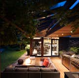 Outdoor, Concrete Pools, Tubs, Shower, Trees, Wood Patio, Porch, Deck, Grass, Large Patio, Porch, Deck, Swimming Pools, Tubs, Shower, Stone Fences, Wall, Lap Pools, Tubs, Shower, Gardens, Back Yard, Decking Patio, Porch, Deck, Hardscapes, and Landscape Lighting Geometric House - ONE SEED Architecture + Interiors: Outdoor Living  Photo 3 of 17 in Geometric House - ONE SEED Architecture + Interiors by ONE SEED Architecture + Interiors