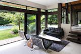 Geometric House - ONE SEED Architecture + Interiors: Lounge opening to exterior
