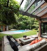 Outdoor, Small Pools, Tubs, Shower, Large Pools, Tubs, Shower, Swimming Pools, Tubs, Shower, Hardscapes, Concrete Pools, Tubs, Shower, Decking Patio, Porch, Deck, Wood Patio, Porch, Deck, Grass, Standard Construction Pools, Tubs, Shower, Trees, and Back Yard Geometric House - ONE SEED Architecture + Interiors: Outdoor Living  Photo 17 of 17 in Geometric House - ONE SEED Architecture + Interiors by ONE SEED Architecture + Interiors