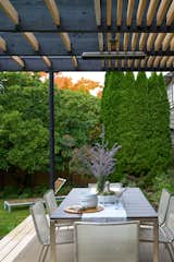 Outdoor, Back Yard, Grass, Gardens, Hardscapes, Trees, Garden, Decking Patio, Porch, Deck, Small Patio, Porch, Deck, Wood Patio, Porch, Deck, and Wood Fences, Wall West Side Clerestory - Covered outdoor dining  Photo 15 of 50 in West Side Clerestory by ONE SEED Architecture + Interiors