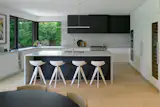 West Side Clerestory - Kitchen with corner window and local Vancouver Island white marble counters and backsplash.