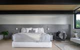 West Side Clerestory - Primary bedroom and soft grey oak headboard running the full length of the room.