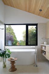 West Side Clerestory - Primary ensuite.  A large window provides views to the tree canopy and skies beyond while still providing privacy while bathing.