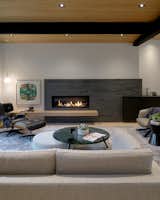 West Side Clerestory - living room fireplace clad in same glazed brick as exterior cladding of house, with floating bench layered over.