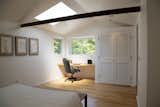 A desk built into the awning-windowed corner offers a peaceful spot of working and creating