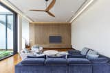 Living room with daylight filtering in from the courtyard. 