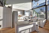 PLANT Architect Inc. reworked the kitchen in the Berkely Live/Work Residence; it's now an airy, open social area.