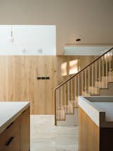 Hardy frosted oak panels line the kitchen staircase.