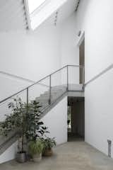The pared-back, triple-height hallway, lit from above, acts an internal courtyard.&nbsp;