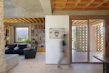Heated brick floors are underfoot, with oak joinery adding warmth to the exposed concrete beams.