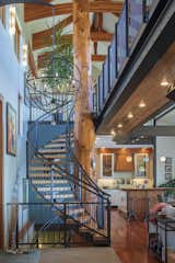 Indoor red cedar totem, 37’ high, spanning 3 floors