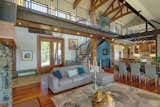 Indoor red cedar totem, 37’ high, spanning 3 floors