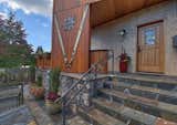 Wood, stone and stucco  exterior is modern interpretation of Swiss mountain design.