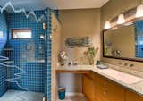 The home is full of exquisite details from custom recycled glass counter tops and innovative design features throughout.