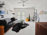 Living room featuring art by James Angel and sofa by [Chase Warren Design X Anthony W Design]