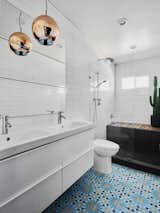 Bathroom featuring a hidden tub that doubles as an Ipe shower bench