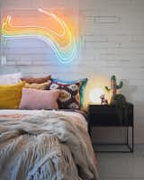 Bedroom featuring art by Lily Reeves