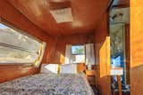 Custom double bed in the private sleeping cabin.
