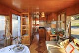 A well equipped kitchen, custom flooring by designer. AC and heat. Midcentury accoutrements.