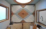 The bottom of the bed features a Southwest-inspired pattern that the Parhams designed together. "We wanted to have something beautiful to look at while sitting on the couch if the bed was raised up," says Greg. 