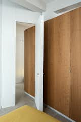 Bedroom entry with a custom door designed by the architects. 