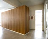 Cherry wood millwork unit as a multi purpose storage space 