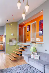 A mix of original and modern elements combine to create a colorful, mid-century modern vibe. Original art.