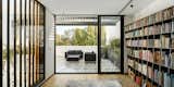 Living Room, Light Hardwood Floor, Bookcase, and Wall Lighting  Photo 16 of 17 in Cachai House by taller paralelo